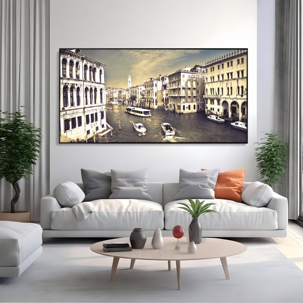 Tablou canvas cu panoramica cu canale si barci in venetia, in rama de aluminiu negru, pe perete intr-un living